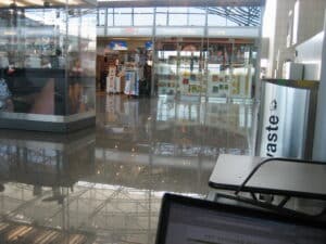 Travelers with luggage inside an airport terminal