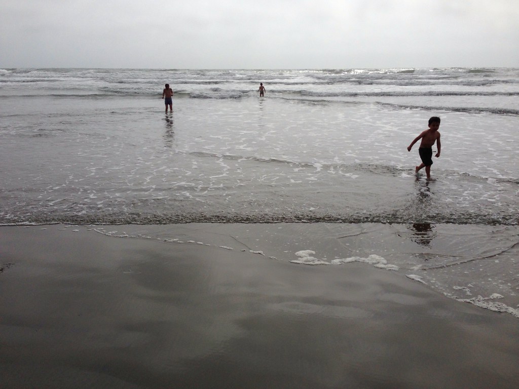 Kids playing on the sand at a Southern California beach